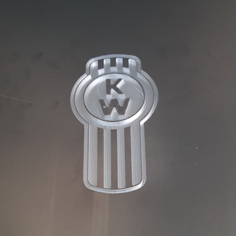 Clear acrylic emblem routed and engraved from solid sheet
